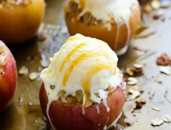 Delicious apple crisp stuffed baked apples ready to enjoy as a dessert.
