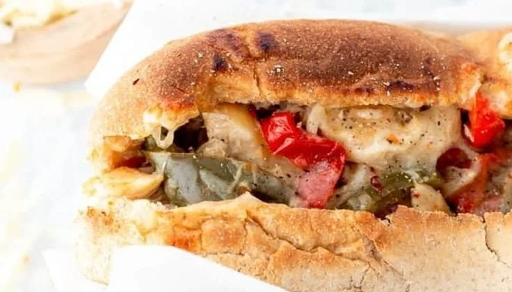 Crockpot Chicken Philly Cheesesteak served on a plate with toppings