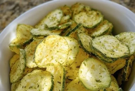 Oven-baked crunchy ranch cucumber chips on a plate.