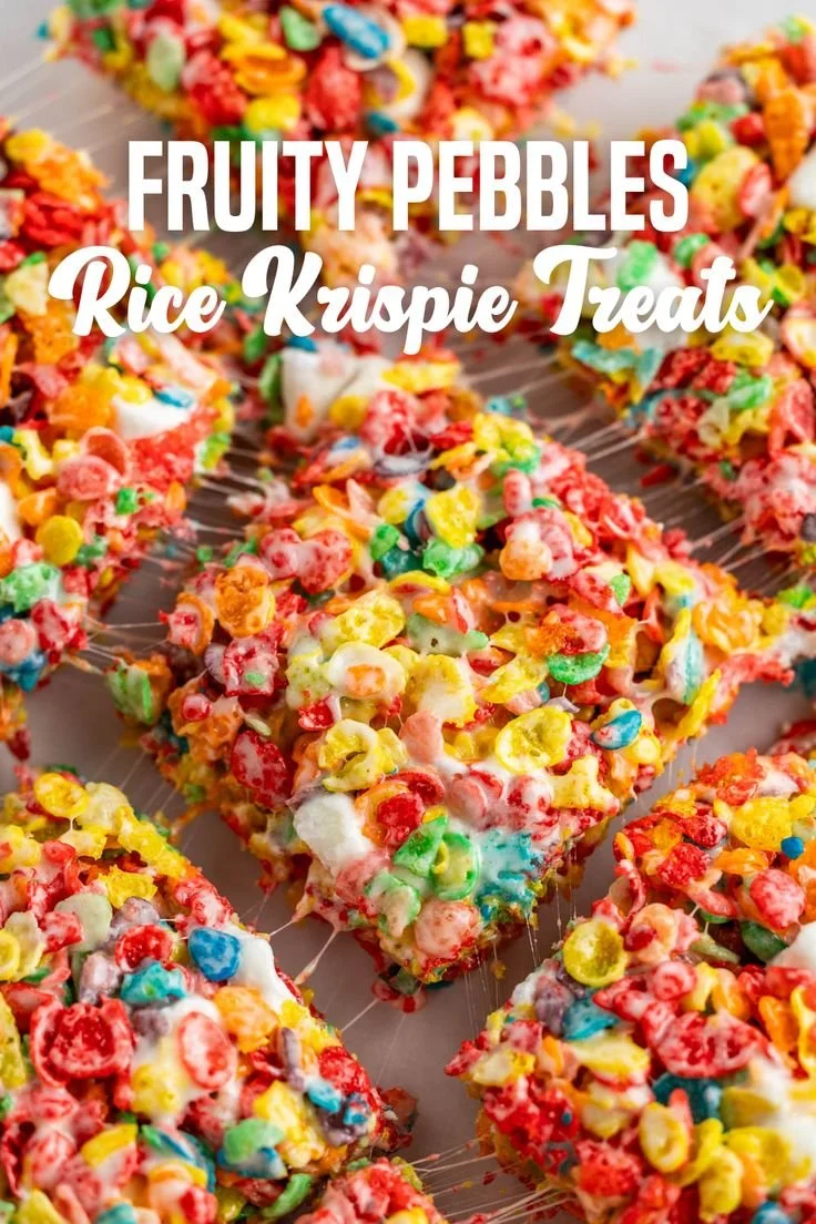 Colorful Fruity Pebbles Rice Krispie Treats stacked on a plate