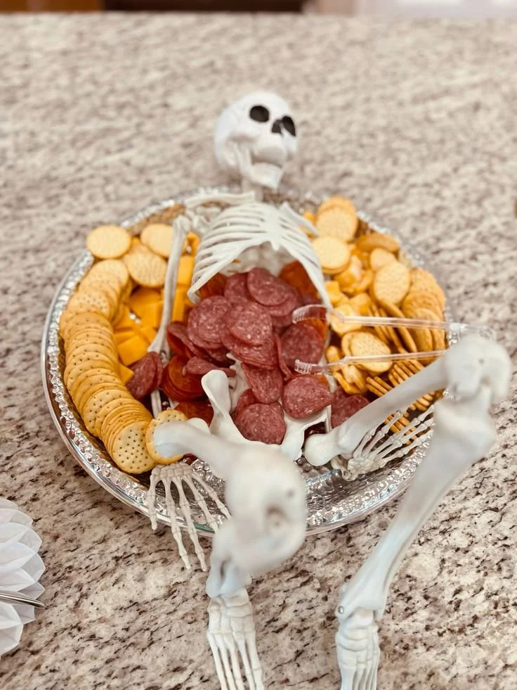 Spooky Halloween themed charcuterie board with festive treats