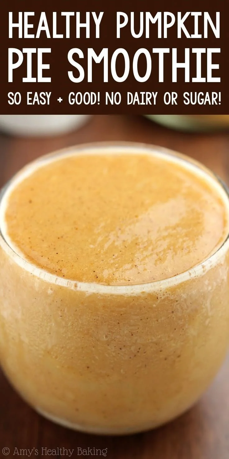 Healthy pumpkin pie smoothie in a glass, garnished with cinnamon and whipped cream.