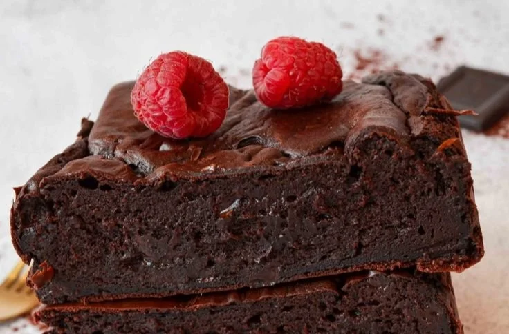 Delicious high protein brownies on a plate, perfect for a healthy snack.