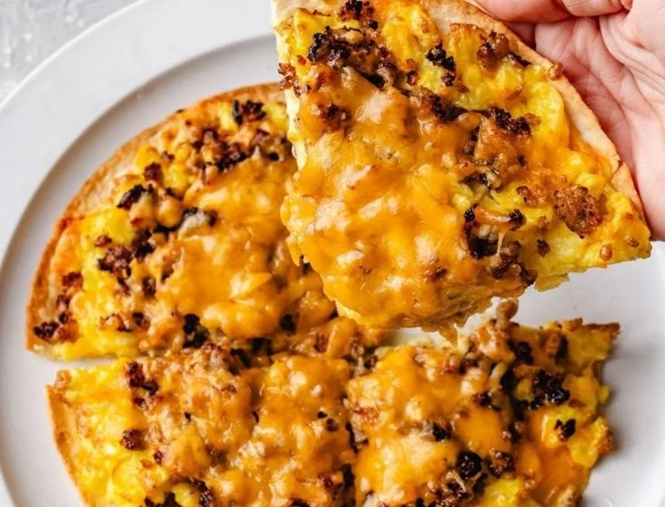High protein sausage and egg breakfast pizza topped with fresh ingredients