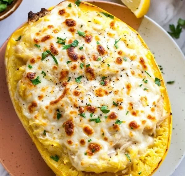 Healthy Skinny Chicken Alfredo over spaghetti squash, a low-carb meal idea.