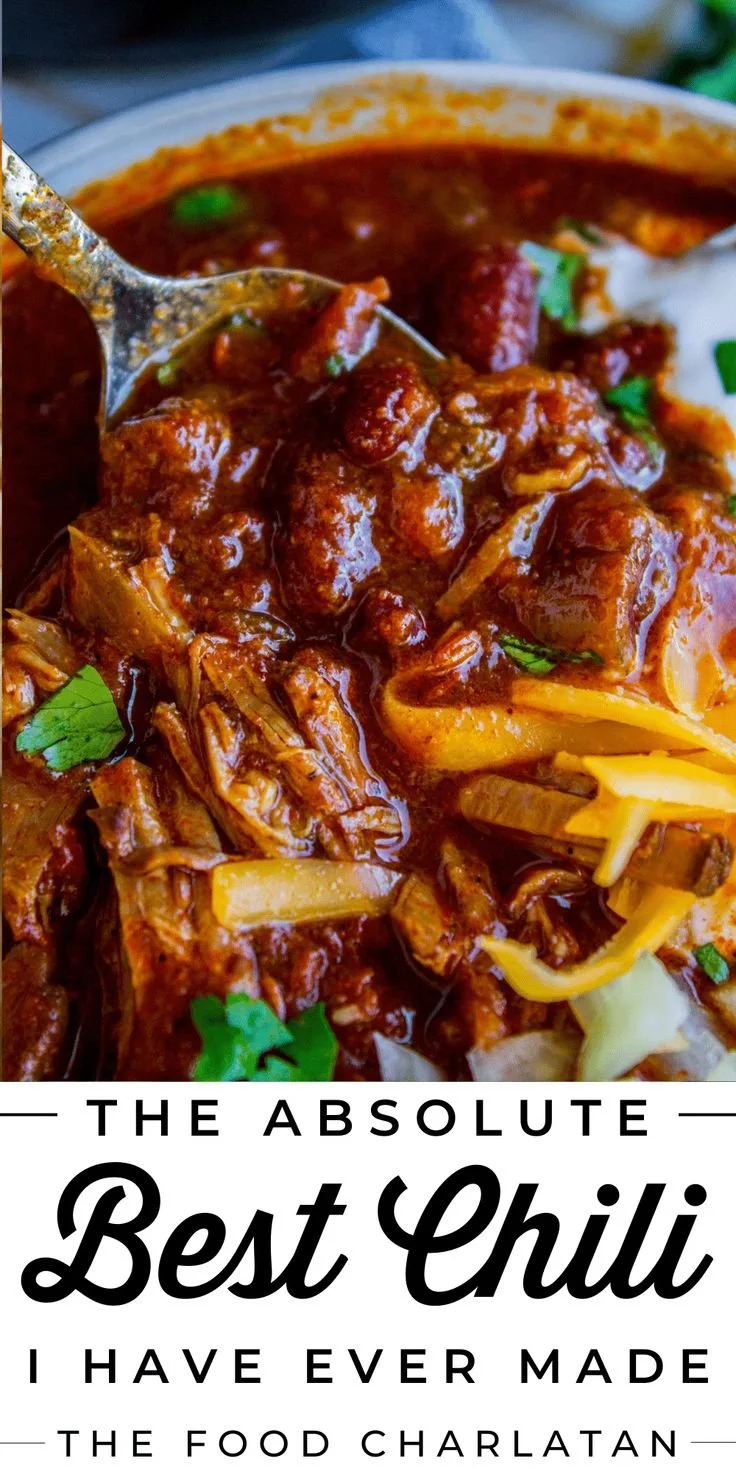 A bowl of delicious slow cooker chili topped with fresh herbs and cheese